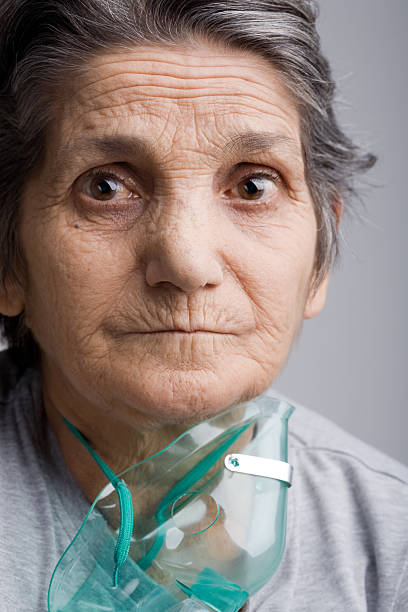 istock Senior woman with oxygen mask 113539384