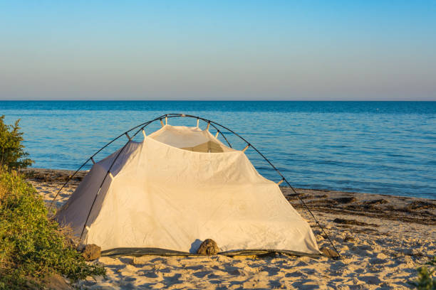 istock Tent by the sea at sunset. 1135396155