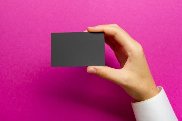 istock Hand holding white business card on white background 1135400764