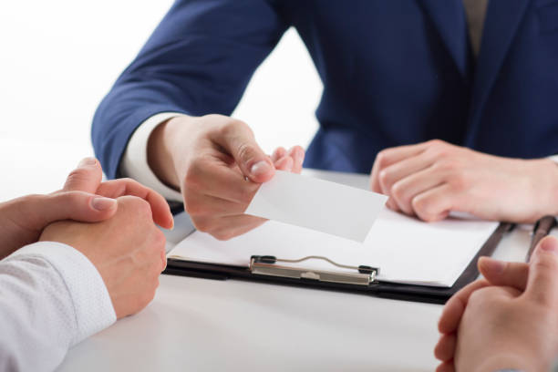 istock business executive exchanging business card blank 1135400830