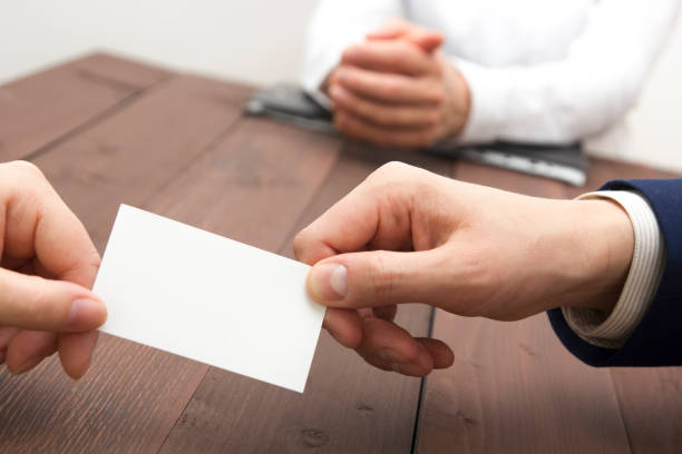 istock business executive exchanging business card blank 1135400839