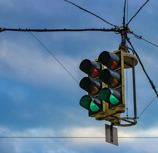 istock Green color on traffic light on blue sky background 1135409554
