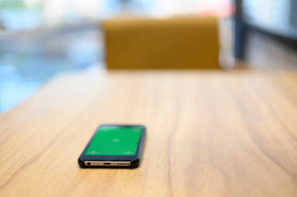 istock Black mobile phone placed on the desk 1135411962