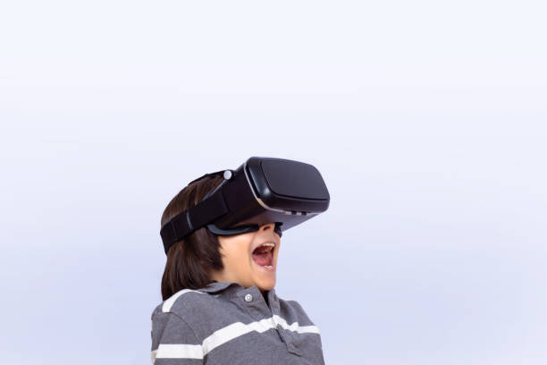 istock Little boy playing video games with VR. 1135414370