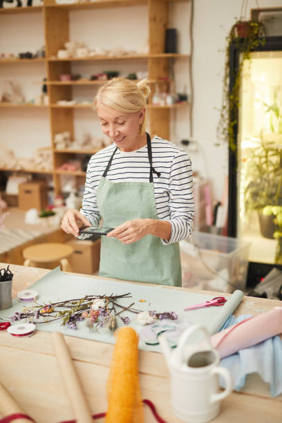 istock Florist taking photo 1135416004