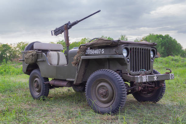 Jeep with a machine gun of the American army at a historical reconstruction in honor of the anniversary of victory in World War II Kiev, Ukraine - May 09, 2018: Jeep with a machine gun of the American army at a historical reconstruction in honor of the anniversary of victory in World War II machine gun stock pictures, royalty-free photos & images