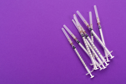 White medical syringes isolated on a mock-up background