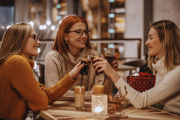 Women toasting with coke