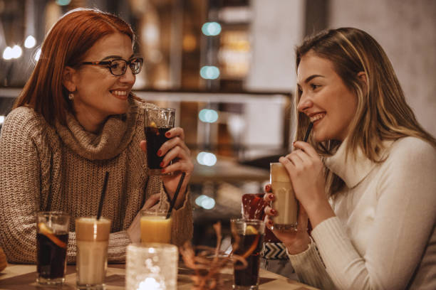 istock Mother and daughter relaxing at the cafe 1135420211