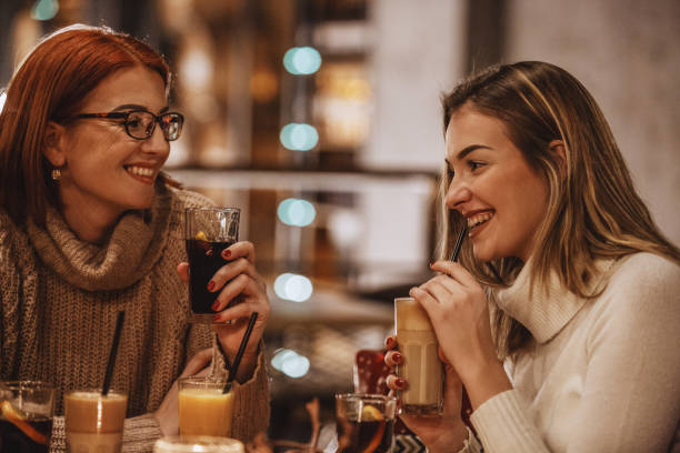 istock Mother and daughter relaxing at the cafe 1135420213