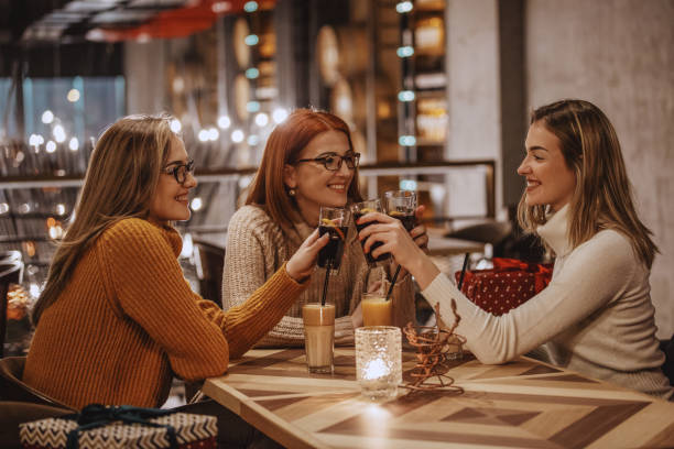 Women toasting with coke