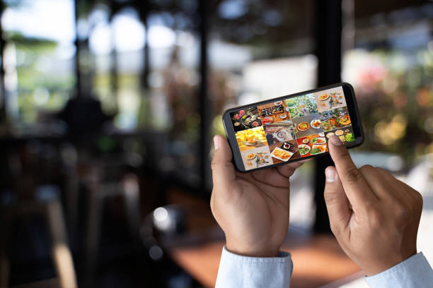 istock man looking phone publicly shared photo on social network 1135421087
