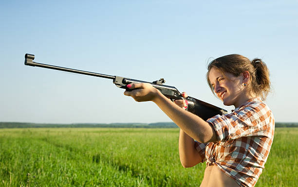 istock Girl with air rifle 113542173