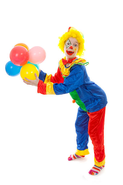 istock child dressed as colorful funny clown with balloons 113542177