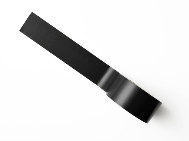istock Isolated shot of black packing tape on white background 1135421921