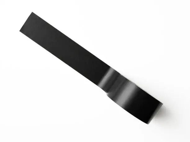 Overhead shot of black packing tape, isolated on white with clipping path.