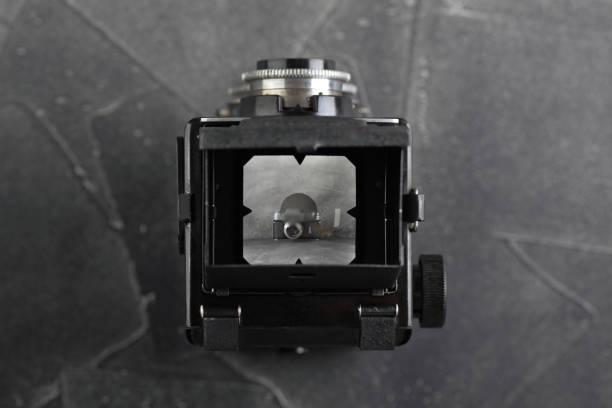 istock The old medium format film TLR camera on grey cement background. 1135422187