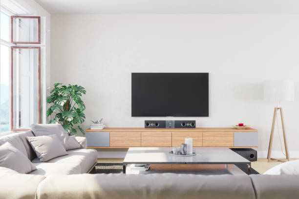 Modern, Bright And Airy Living Room Interior of a modern, bright and airy living room. television set stock pictures, royalty-free photos & images