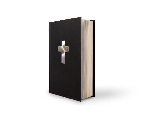 Black book with silver cross on white background with outline paths for easy editing.