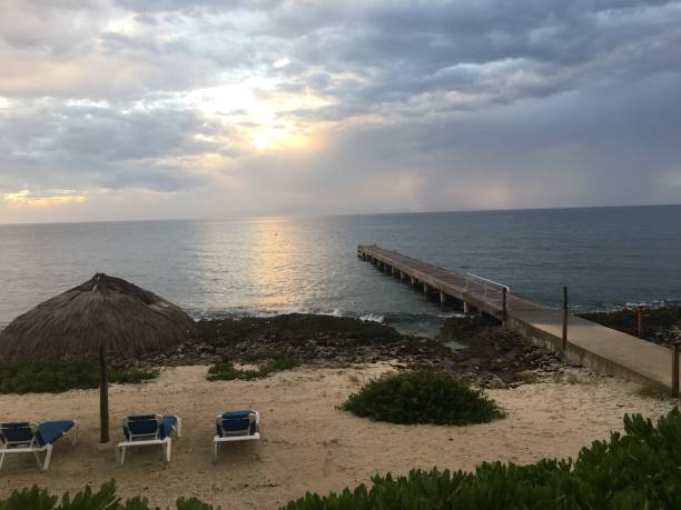 istock Sunset over beach in Grand Cayman 1135432800