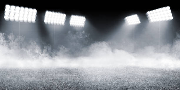 Sports arena with concrete floor with smokes and spotlights Sports arena with concrete floor with smokes and spotlights against dark background sports court photos stock pictures, royalty-free photos & images