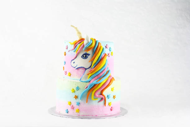 istock Unicorn cake with pink frosting and copy space 1135441600