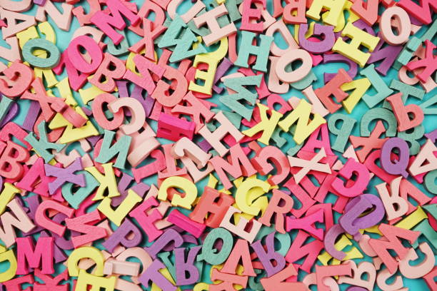 istock random colorful letterpress alphabet top view on purple background 1135441630