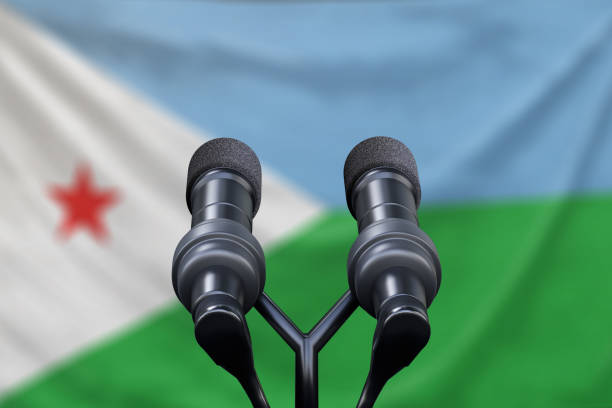 istock Djibouti Flag with microphones at a press conference 1135444701