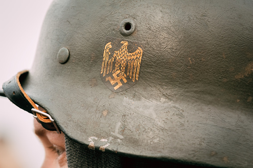 Gomel, Belarus - November 26, 2016: Helmet of German soldier Wehrmacht with Nazi symbols. Reconstruction