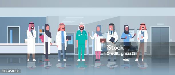 Group Of Arabic Doctors Team Treatment Communication Concept Arab Medical Hospital Mix Race Workers Standing Together Modern Clinic Hall Interior Full Length Horizontal Stock Illustration - Download Image Now