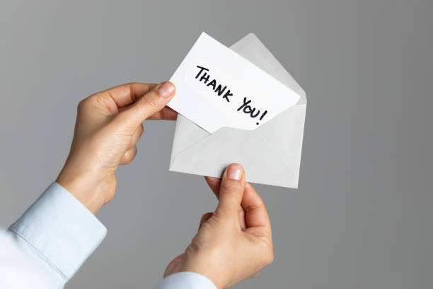 istock Woman with Thank You Card 1135451674