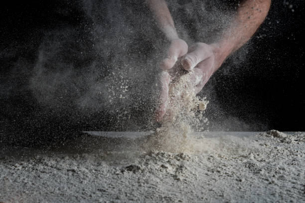 istock Man prepares a meal of flour 1135452537