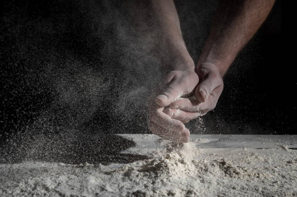 istock Man prepares a meal of flour 1135452572