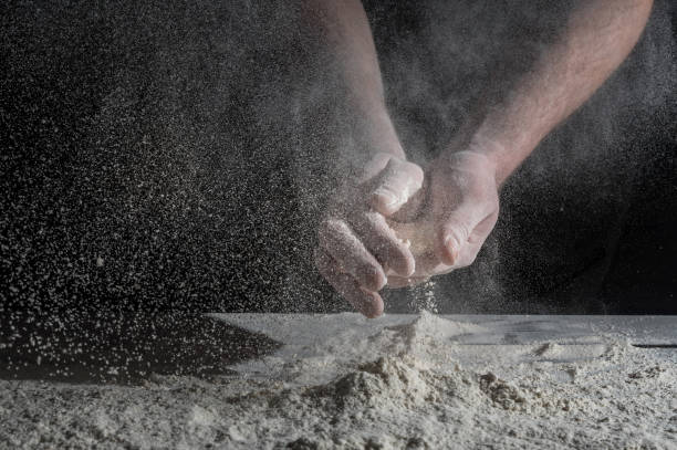 istock Man prepares a meal of flour 1135452578