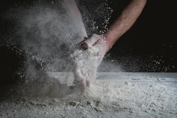 istock Man prepares a meal of flour 1135452600