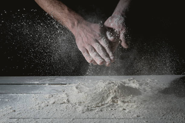 istock Man prepares a meal of flour 1135452624