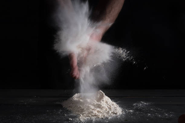 istock Man prepares a meal of flour 1135452640