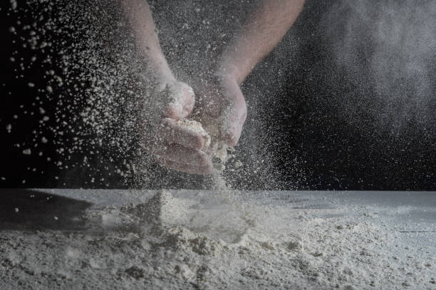 istock Man prepares a meal of flour 1135452649