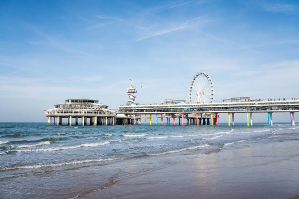 The pier of Scheveningen at the coast of the North Sea. City of The Hague. Beach