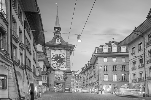Zytglogge clock tower on Kramgasse street with shopping area in old city center of Bern, Switzerland at twilight