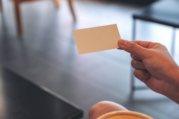 istock A woman holding an empty business card 1135456787