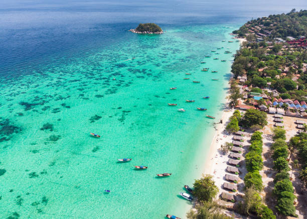 istock Long-tail boat on emerald tropical sea at Lipe island 1135463857