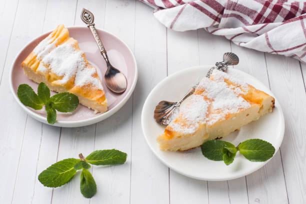 istock Cottage cheese casserole on a plate with powdered sugar and mint leaves. Selective focus 1135463913