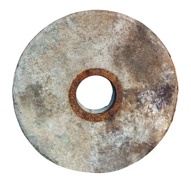 Photo of Aged  Stone wheel for mill  isolated o