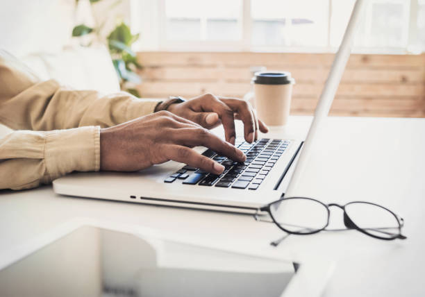 istock Men working at home. Freelancer businessman using laptop 1135469113