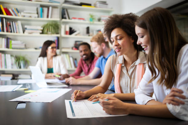 istock Team of colleagues brainstorming together while working in modern office 1135471497