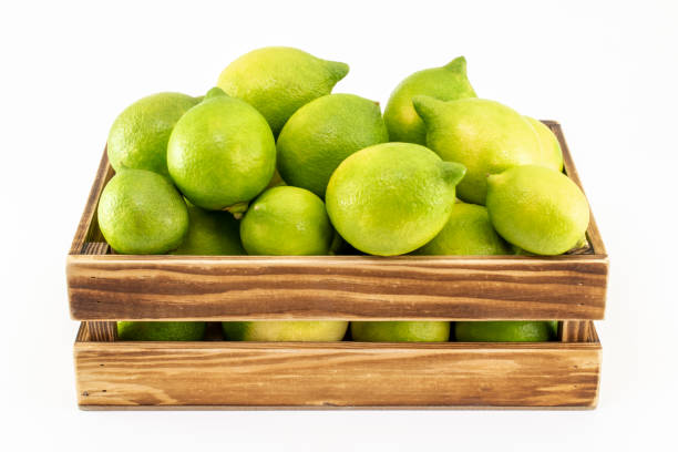 istock Lemons in wooden crate, isolated on white background 1135471512