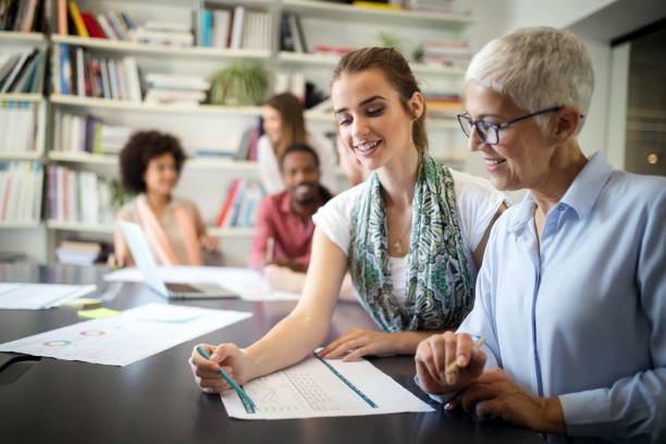 istock Team of colleagues brainstorming together while working in modern office 1135471527