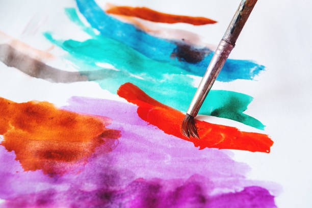 istock watercolor palette, the child draws with paints 1135472568