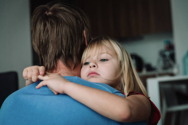 istock father comforting stressed sad daughter at home 1135476957